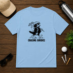 Chasing Birdies- Funny retro vintage style golf shirt of a bird carrying a golf bag full of clubs. 
