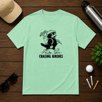 Chasing Birdies- Funny retro vintage style golf shirt of a bird carrying a golf bag full of clubs. 