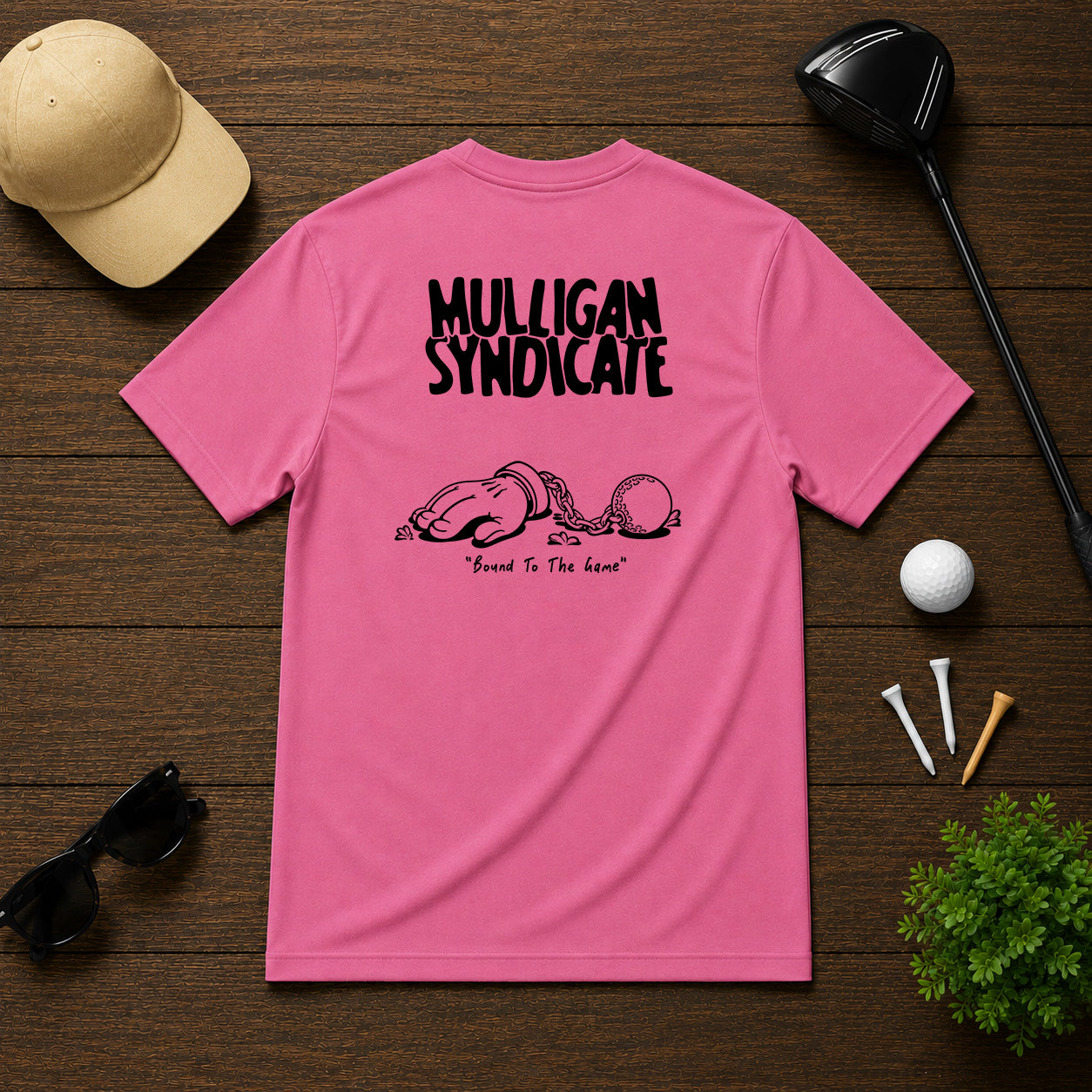 Mulligan Syndicacte Bound To The Game-  Cartoon hand connected to a golf ball by a chain. Sarcastic funny joke humor golf tee.