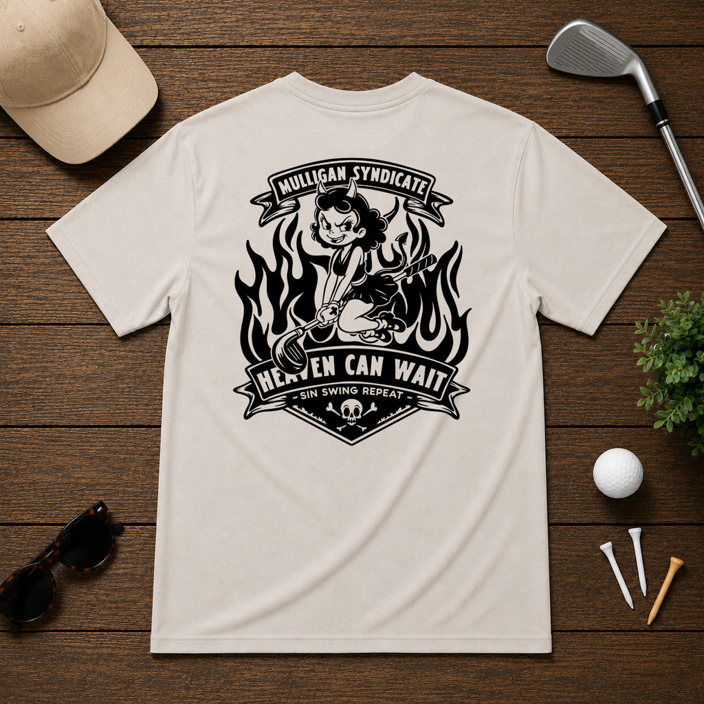 Retro style golf pinup tee shirt. Devilish girl ridding on a golf club, with flames in the background, with the saying Heaven Can Wait.