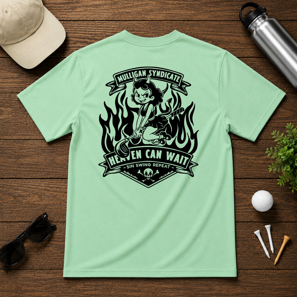 Retro style golf pinup tee shirt. Devilish girl ridding on a golf club, with flames in the background, with the saying Heaven Can Wait.