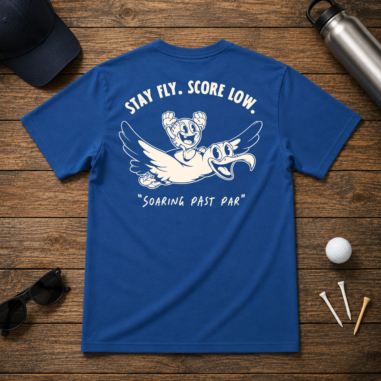 Funny golfing albatross golfer shirt. Golf Ball character riding on the back of an albatross, soaring through the air.