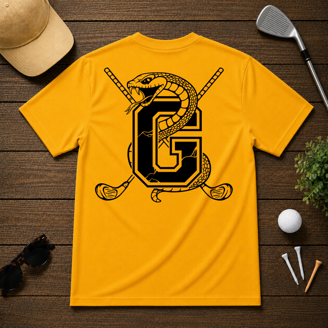 Varsity style golf shirt with a snake wrapped around the letter "G", with a pair of golf clubs in the back.