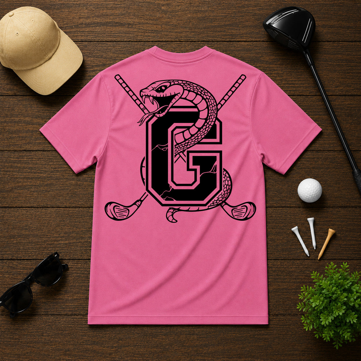 Varsity style golf shirt with a snake wrapped around the letter "G", with a pair of golf clubs in the back.