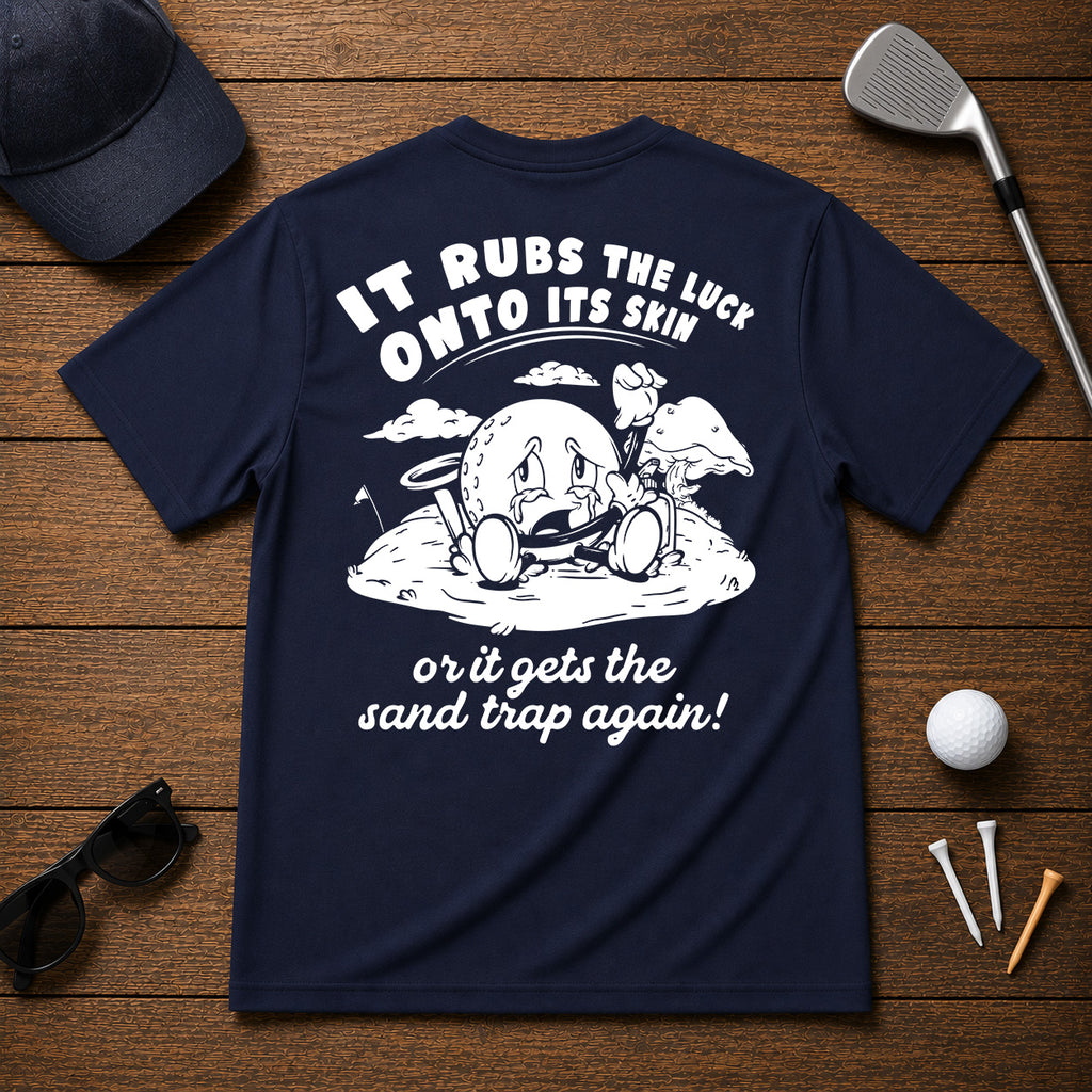 It Rubs The Luck Onto Its Skin- Funny sarcastic joke shirt for golfers that have bad luck on the golf course. Funny golf ball character rubbing luck lotion in itself, in hopes of getting to the hole.