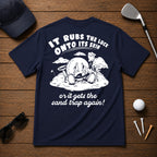 It Rubs The Luck Onto Its Skin- Funny sarcastic joke shirt for golfers that have bad luck on the golf course. Funny golf ball character rubbing luck lotion in itself, in hopes of getting to the hole.