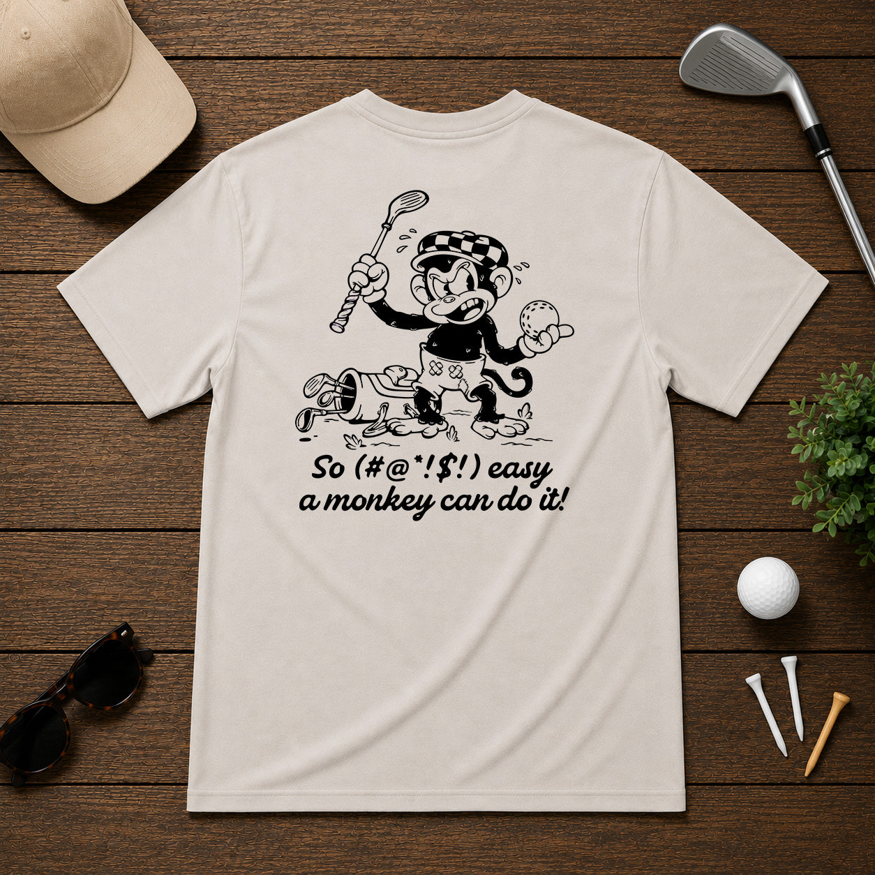 Mulligan Syndicate Retro sarcastic funny monkey golfing shirt. Monkey holding a golf ball in anger, for it not going where it was intended. 