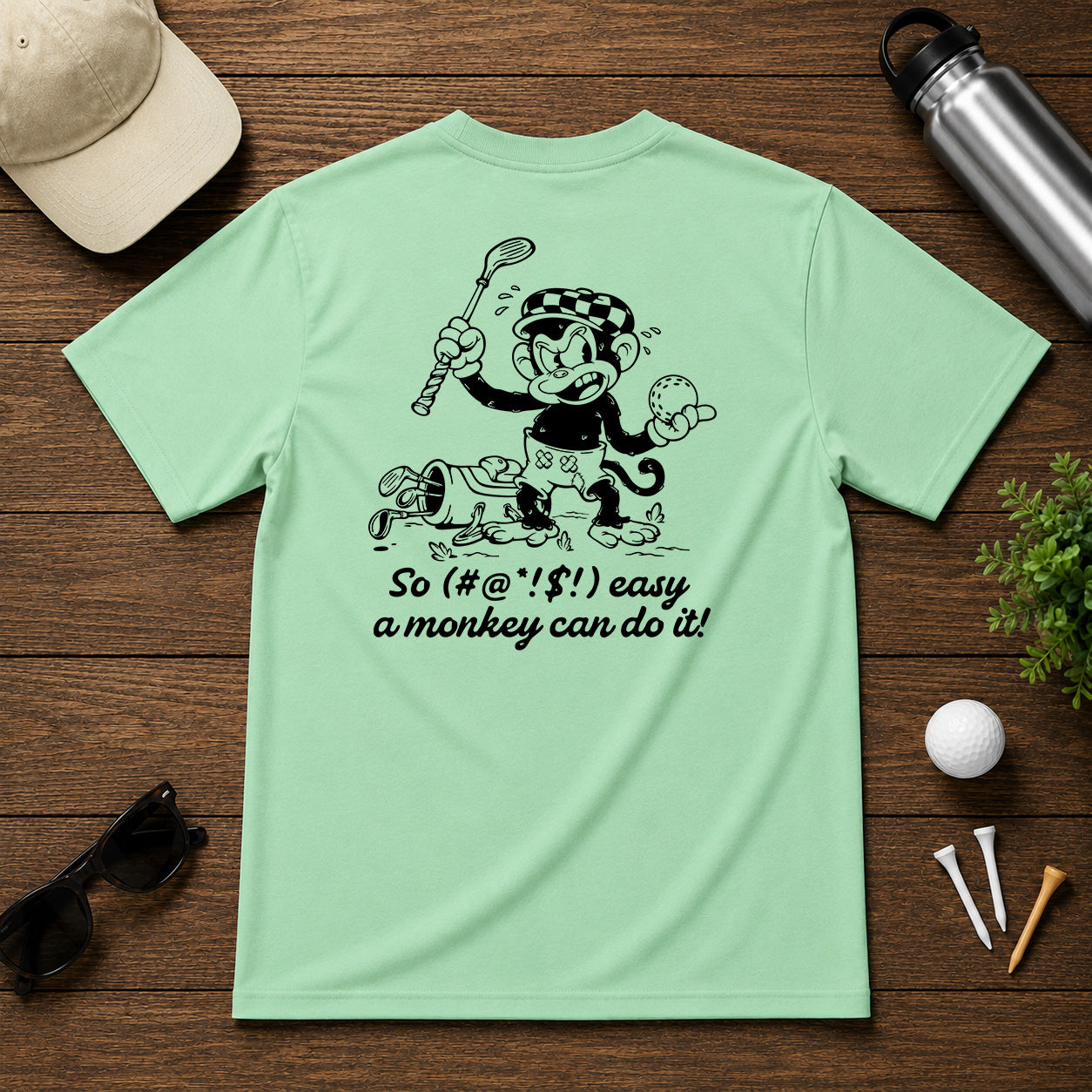 Mulligan Syndicate Retro sarcastic funny monkey golfing shirt. Monkey holding a golf ball in anger, for it not going where it was intended. 