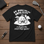 It Rubs The Luck Onto Its Skin- Funny sarcastic joke shirt for golfers that have bad luck on the golf course. Funny golf ball character rubbing luck lotion in itself, in hopes of getting to the hole.