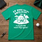 It Rubs The Luck Onto Its Skin- Funny sarcastic joke shirt for golfers that have bad luck on the golf course. Funny golf ball character rubbing luck lotion in itself, in hopes of getting to the hole.